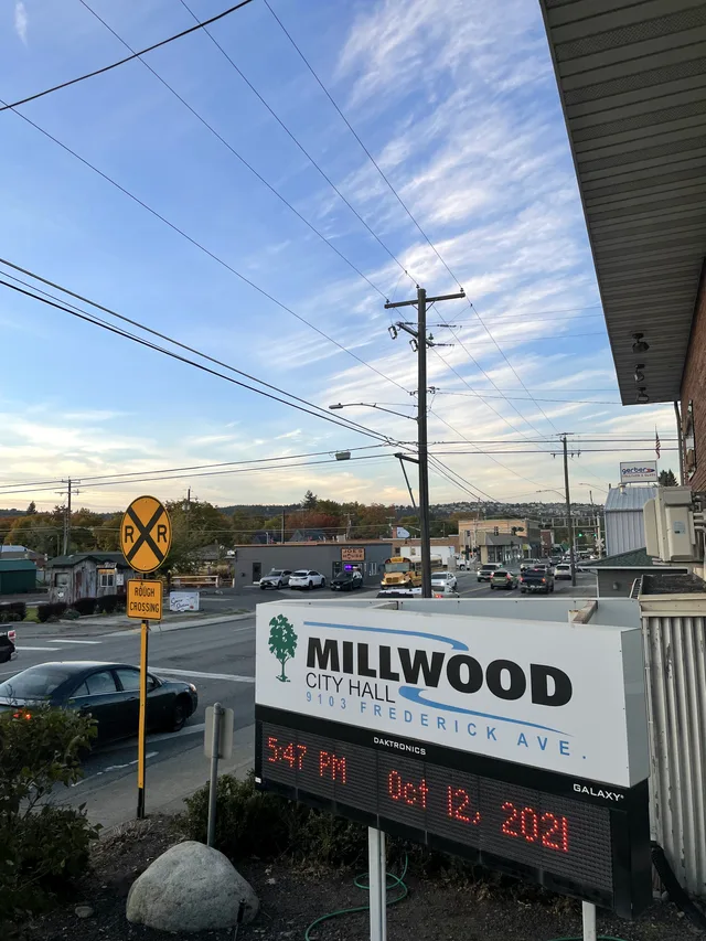 Millwood City Hall and Argonne Road during evening traffic. The old commercial center of Millwood is visible a couple of blocks to the north.