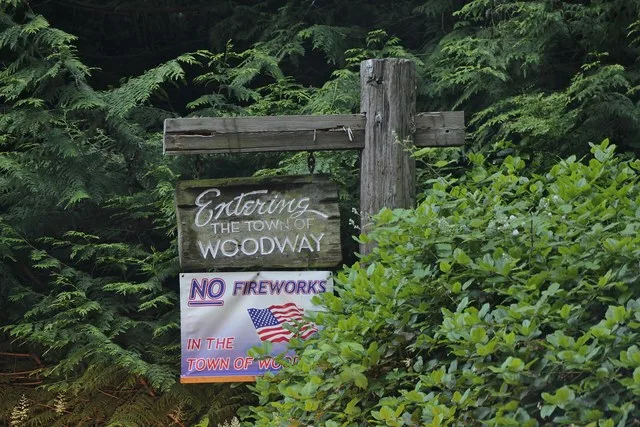 A welcome sign for Woodway , a suburb of Seattle in Snohomish County, Washington .