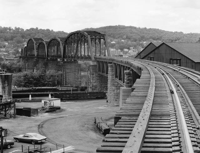 Westward along the railroad tracks on the B & O Railroad Viaduct , which spans the Ohio River between Bellaire , Ohio and Benwood , West Virginia , United States . Photo is taken...