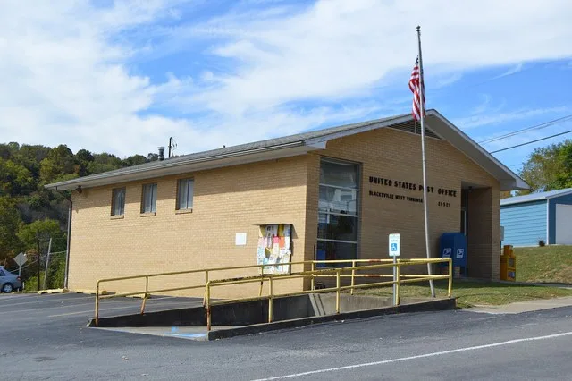 Front and southern side of the post office in Blacksville , West Virginia , United States , located at 46 Daybrook Road ( West Virginia Route 218 .