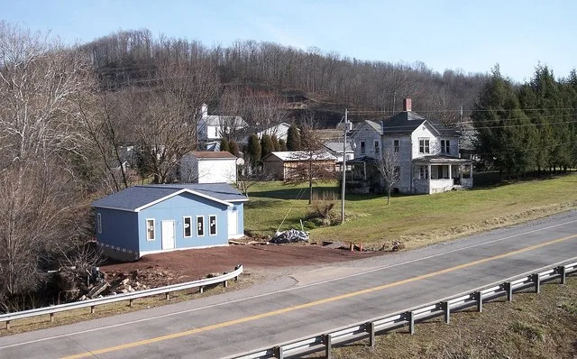 Buildings along w:West Virginia Route 16 in w:Ellenboro, West Virginia , as viewed from the w:North Bend Rail Trail