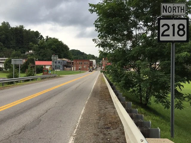 View north along West Virginia State Route 218 (Main Street) at U.S. Route 250 (Husky Highway) in Farmington, Marion County, West Virginia