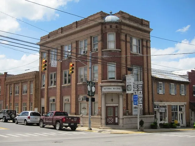The National Building , also known as the Old First National Bank of Romney Building, is an early 20th century commercial building located at the corner of High and Main Streets i...