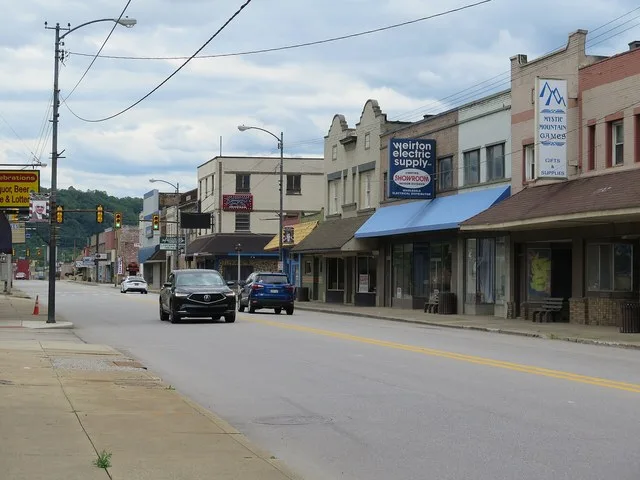 Looking south down Main Street in downtown Weirton, West Virginia. The absence of pedestrian traffic is not something unique to Sundays; most storefronts are vacant.