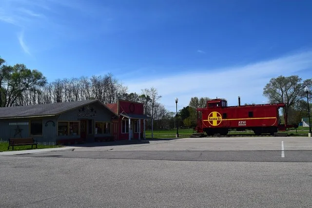 The Avoca Mercantile and an Atchison caboose in Avoca, Wisconsin .