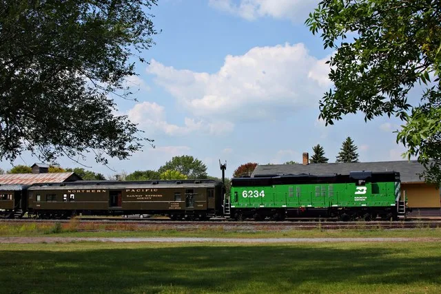 The OSCV 1300 train to Dresser arrives at the restored Soo Line depot. SD9 BN 6234 was repainted by WSOR for MTM in 08.