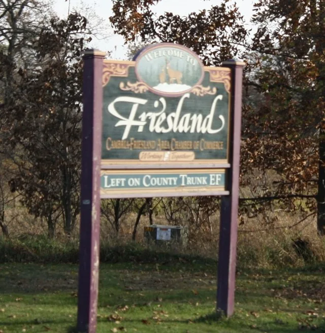The welcome sign w:Friesland, Wisconsin along w:Wisconsin Highway 33 . This file was uploaded with Commonist .