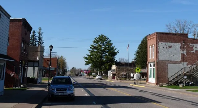 Greenwood is a small city in north-central Wisconsin. This photo shows part of the old downtown, looking north.