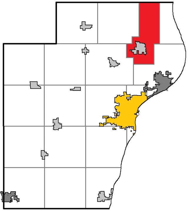 Map of Manitowoc County WI, highlighting the town of Mishicot; with the county seat in gold, cities in gray, and villages in silver