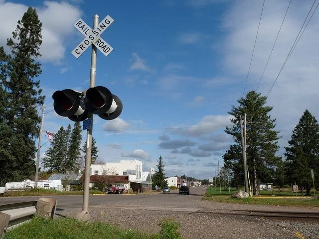 Prentice is a village in the farming and logging country of north-central Wisconsin. Looking north from the railroad crossing, toward the downtown.