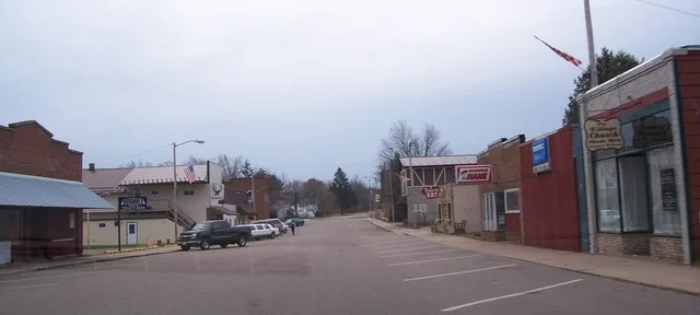Looking south at downtown w:Rosholt, Wisconsin , USA. w:Wisconsin Highway 66 is visible in the background (it goes left/right).
