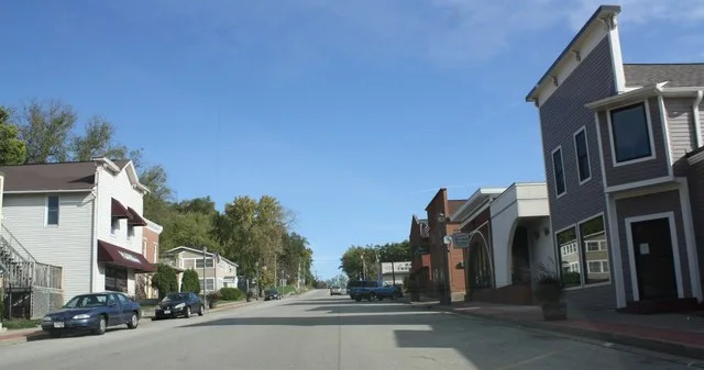 Looking north at downtown w:Trempealeau, Wisconsin . It is listed on the National Register of Historic Places as the w:Main Street Historic District (Trempealeau, Wisconsin) .