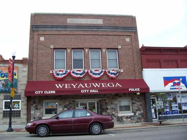 The city hall for w:Weyauwega, Wisconsin in downtown along the Yellowstone Trail (sign pictured).