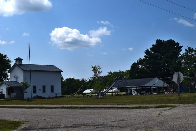 Village office building and public park in the village of Woodman, Wisconsin .