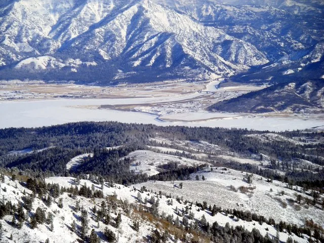 View of Alpine (Alpine Junction) including portions of Snake River Canyon, Greys River Canyon, Salt River, and Palisades Reservoir. View from atop nearby Black Mountain (Idaho).